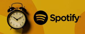 Logo do Spotidy ao lado de um despertador.