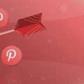 flecha acertando o centro de um alvo e vários ícones do Pinterest flutuando ao redor