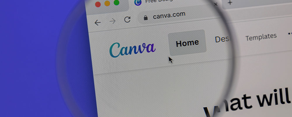 site Canva aberto em um navegador com uma lente de aumento na frente do logo