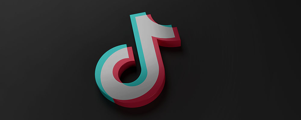 logo do TikTok sobre um fundo escuro