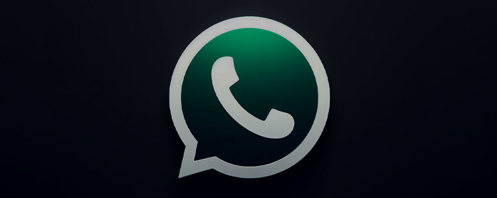 logo WhatsApp sobre um fundo escuro