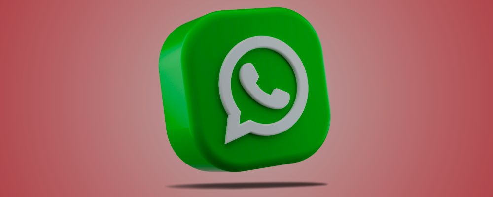 Logo do WhatsApp sobre um fundo rosa.